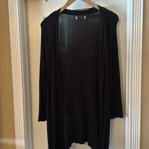 Long sweater with shorter sleeves.
